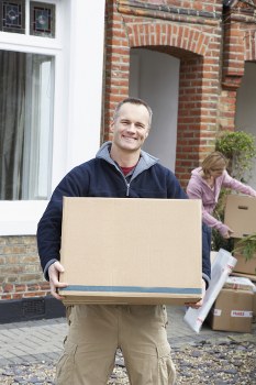 Local removals team planning a move in Kensington with boxes and furniture