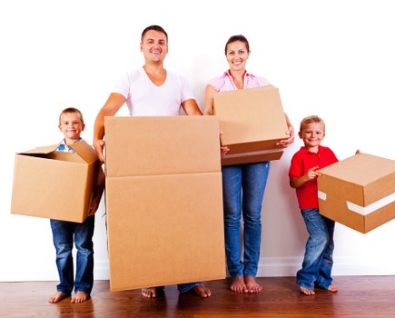 Movers handling furniture in a Kensington flat with care