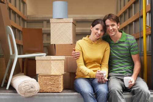 Local movers preparing bulky furniture for a Kensington flat relocation