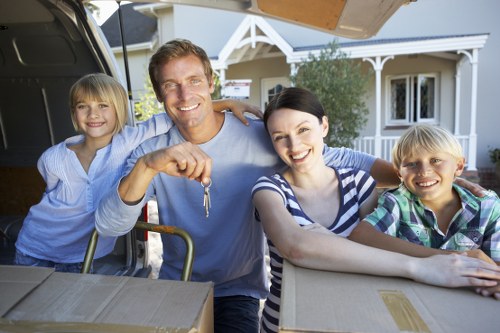 Local moving team loading furniture for a Kensington move