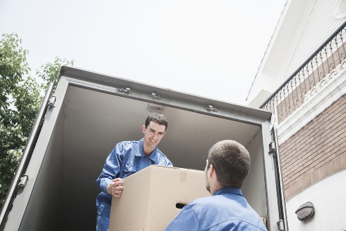 Professional movers handling apartment furniture in Kensington