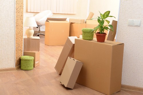Professional movers handling office furniture near Kensington